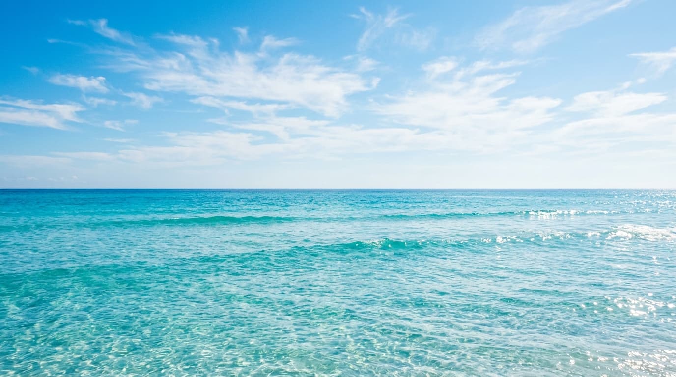 Bright sunlit daytime ocean with crystal clear turquoise water